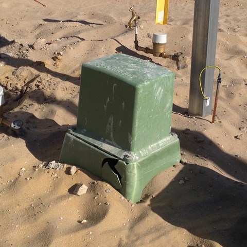 green dome cracked in sand