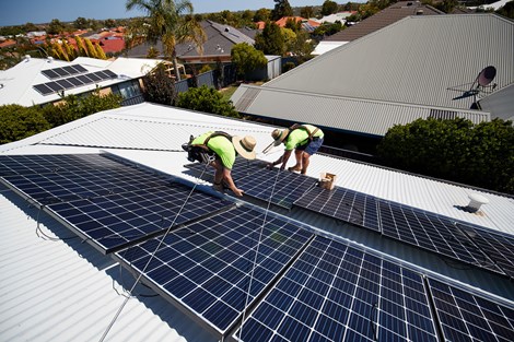 Men working on the roof installing solar